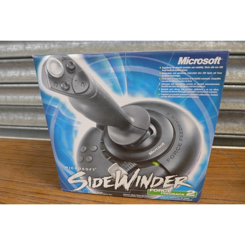 2234 - A Microsoft Sidewinder Force Feedback 2 joystick and three flight simulator games and Microsoft Word... 