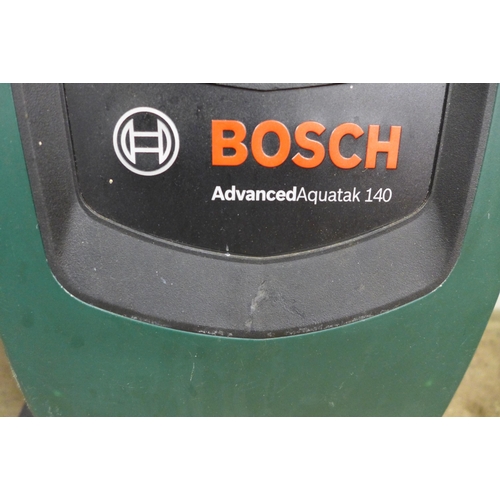 2253 - A Bosch Advanced Aquatak 140 pressure washer with hose and lance