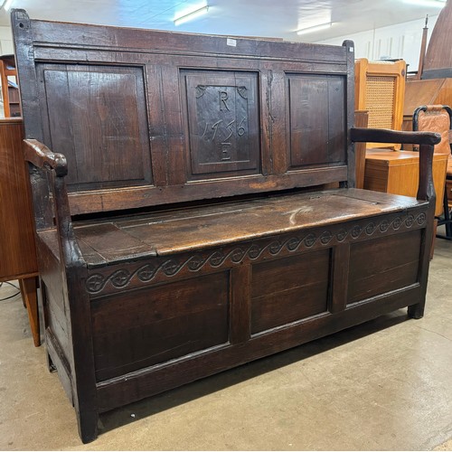 122 - A George II oak settle, dated 1736