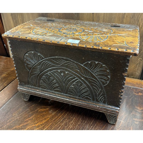 123 - A small William III carved oak box