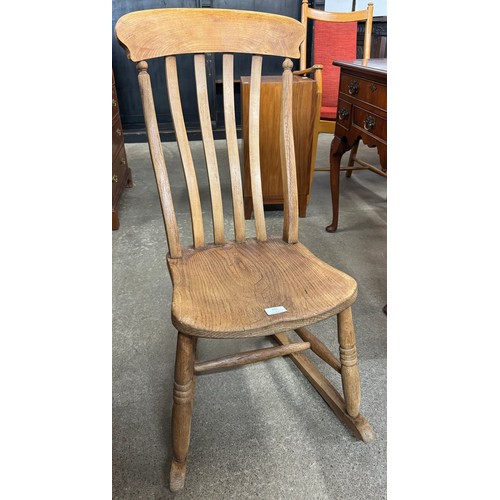 132 - A Victorian beech rocking chair