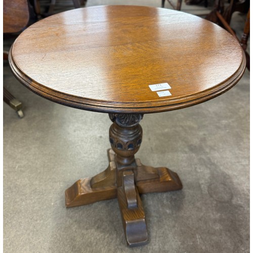 171 - An Old Charm carved oak circular occasional table