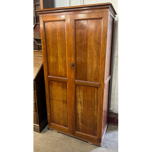 140 - A late Victorian fitted oak two door cupboard