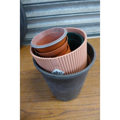 2175 - A collection of plastic plant pots and planters
