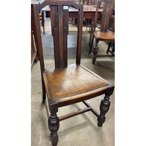 179 - A set of four oak dining chairs