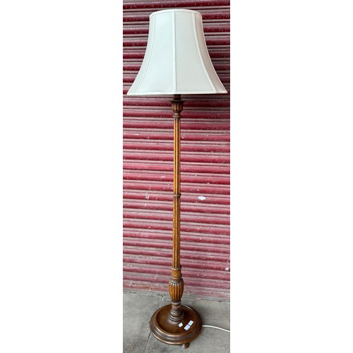 187 - An oak standard lamp