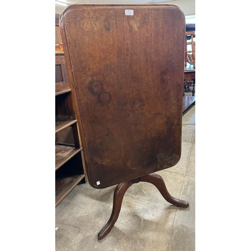 217 - A Victorian mahogany fold over tripod tea table