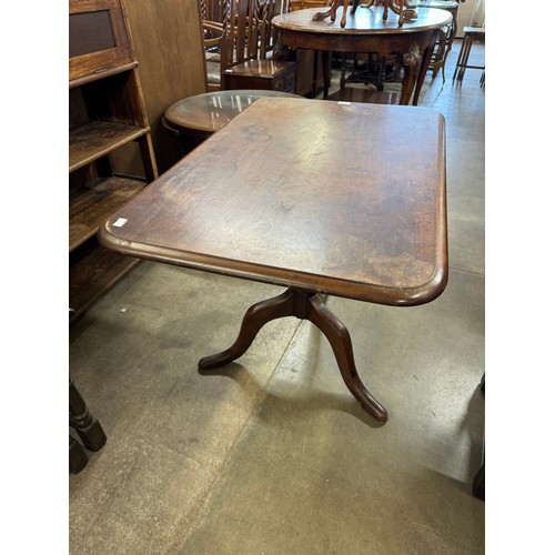 217 - A Victorian mahogany fold over tripod tea table