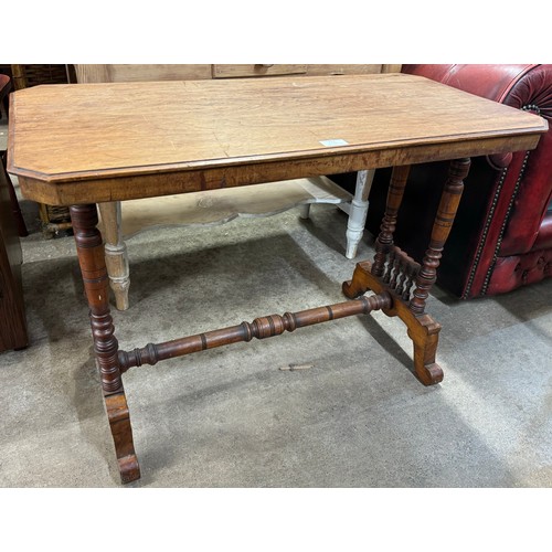 232 - A Victorian walnut stretcher table