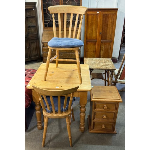 234 - A pine kitchen table and two beech chairs and a small pine chest