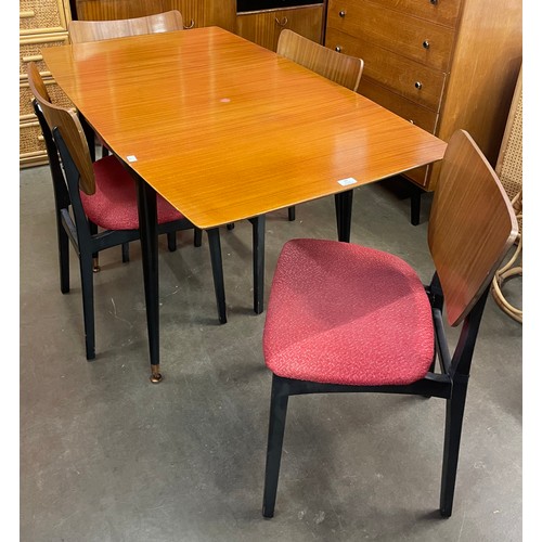 84 - A Homeworthy tola wood and black drop leaf table and four butterfly back chairs