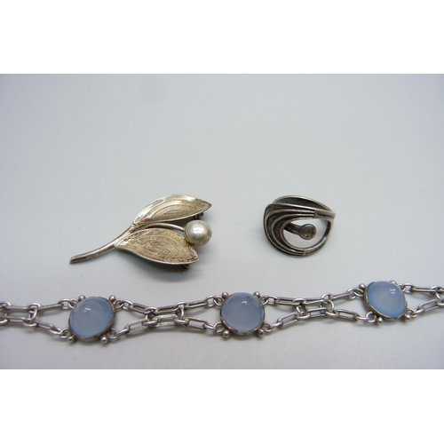 1010 - A Danish Aarre & Krogh silver brooch, a Norwegian silver ring size M and a silver Art Deco chalcedon... 