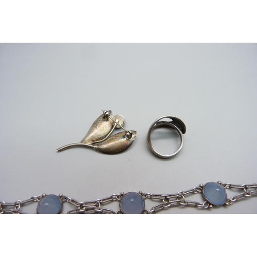 1010 - A Danish Aarre & Krogh silver brooch, a Norwegian silver ring size M and a silver Art Deco chalcedon... 