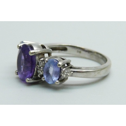 1030 - A 14ct white gold and three stone amethyst and six stone diamond ring, 4.8g, N