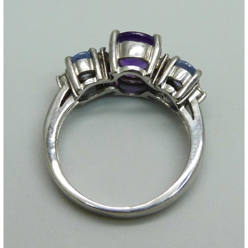 1030 - A 14ct white gold and three stone amethyst and six stone diamond ring, 4.8g, N