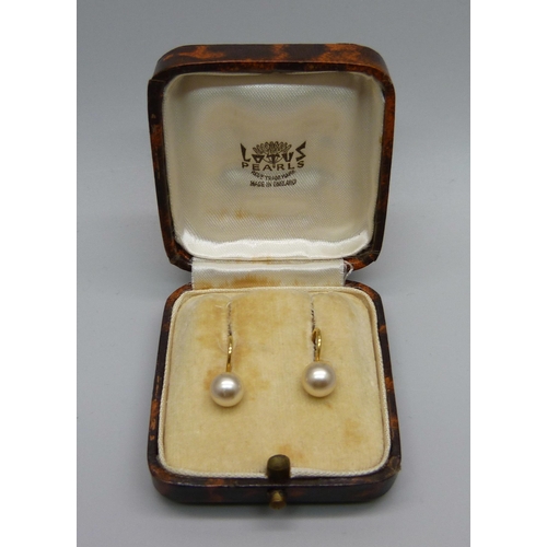 1037 - A pair of 9ct gold and pearl earrings