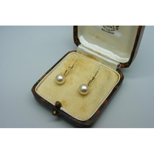 1037 - A pair of 9ct gold and pearl earrings