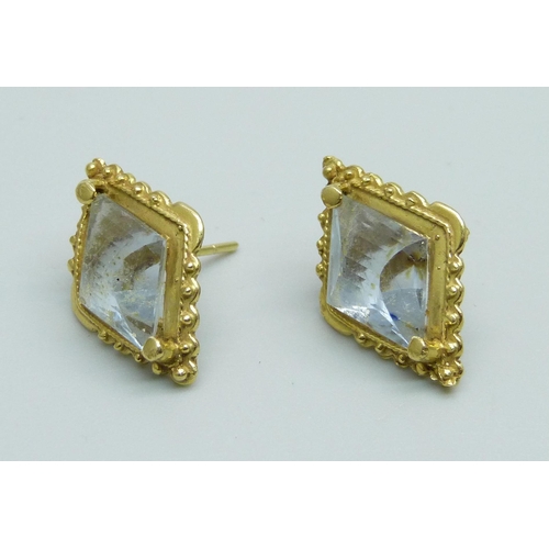 1038 - A pair of Victorian yellow metal earrings set with blue stones, setting tests as 18ct gold, stones t... 