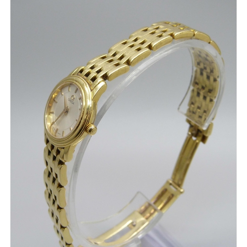 1041 - A lady's 18ct gold Omega wristwatch, 55614690, on an 18ct gold bracelet, 72.8g