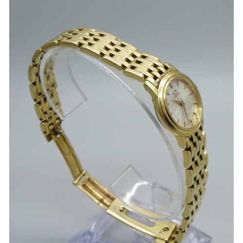 1041 - A lady's 18ct gold Omega wristwatch, 55614690, on an 18ct gold bracelet, 72.8g