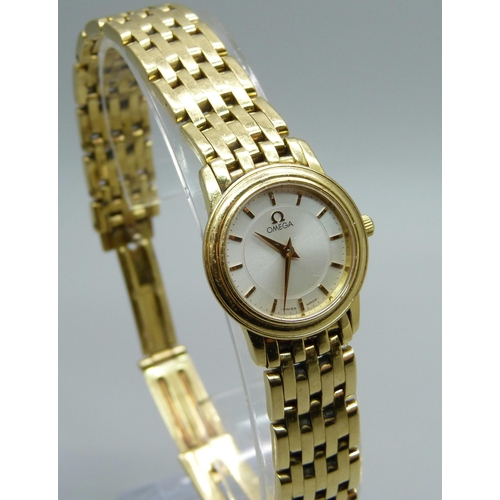 1041 - A lady's 18ct gold Omega wristwatch, 55614690, on an 18ct gold bracelet, 72.8g