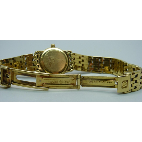 1041 - A lady's 18ct gold Omega wristwatch, 55614690, on an 18ct gold bracelet, 72.8g