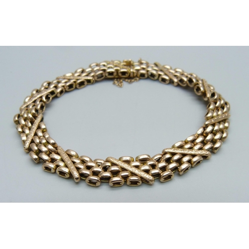 1054 - A 9ct gold bracelet, 14.7g