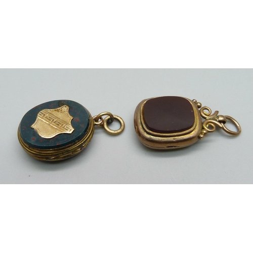 1060 - A locket with loop marked 9ct, 4.1g, a/f, and one other locket