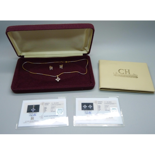 1063 - An 18ct gold and diamond pendant on a chain and a pair of similar earrings, with certificates, 1.27 ... 