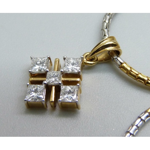 1063 - An 18ct gold and diamond pendant on a chain and a pair of similar earrings, with certificates, 1.27 ... 