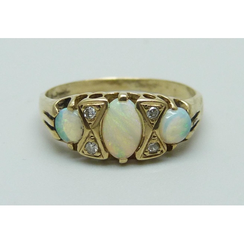 1103 - A 9ct gold opal and diamond ring, 1.8g, K