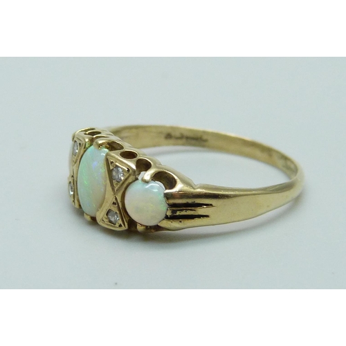 1103 - A 9ct gold opal and diamond ring, 1.8g, K