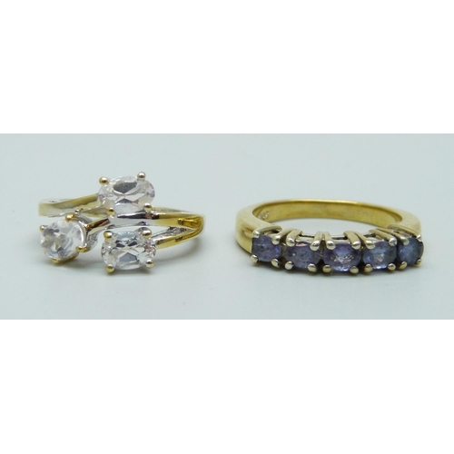 1111 - Two silver gilt rings, one set with tanzanite, J and P