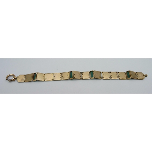 1116 - A rolled gold bracelet with green stones