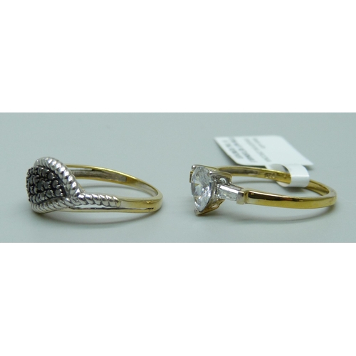 1122 - Two silver gilt rings including black diamond set, marked TGGC, N and R