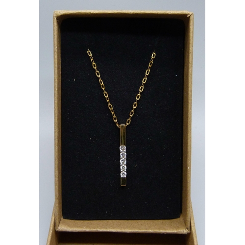 1127 - An 18ct gold five stone diamond pendant on an 18ct gold chain, 1.8g