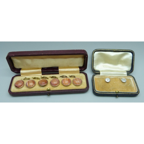 1131 - A pair of boxed 9ct gold studs and a cased set of six buttons