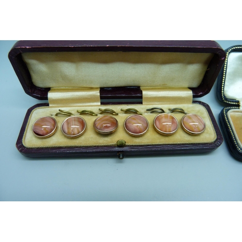 1131 - A pair of boxed 9ct gold studs and a cased set of six buttons