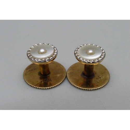 1131 - A pair of boxed 9ct gold studs and a cased set of six buttons