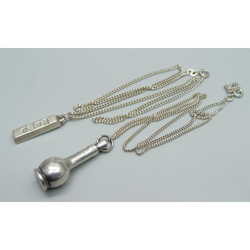 1137 - A silver ingot pendant and chain and a silver scent bottle and chain