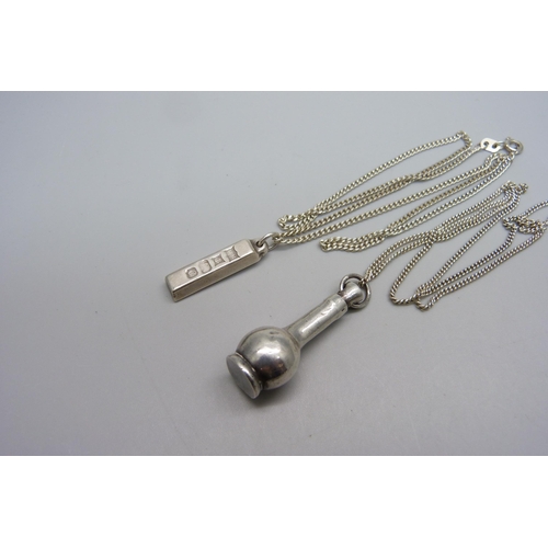 1137 - A silver ingot pendant and chain and a silver scent bottle and chain