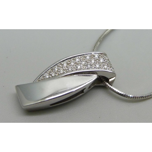 1145 - An 18ct white gold pendant on chain set with diamonds (approximately 0.15ct) and a pair of 9ct white... 