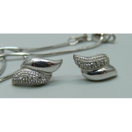 1145 - An 18ct white gold pendant on chain set with diamonds (approximately 0.15ct) and a pair of 9ct white... 