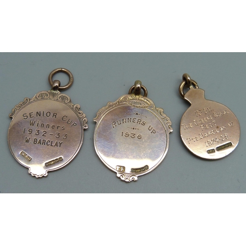 1149 - Three 9ct gold fob medals including one Army football medal, 27.8g