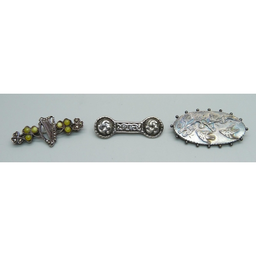 1151 - Three silver brooches including Celtic