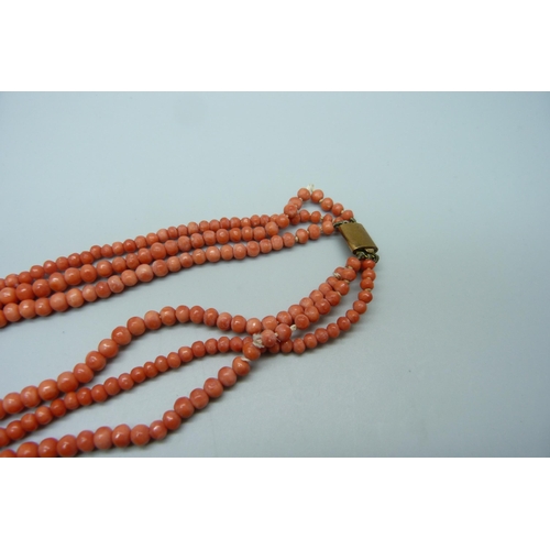 1152 - A three strand coral necklace, one string a/f