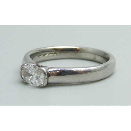 1164 - A platinum set diamond solitaire ring, approximately 0.5ct diamond weight, 6.8g, M