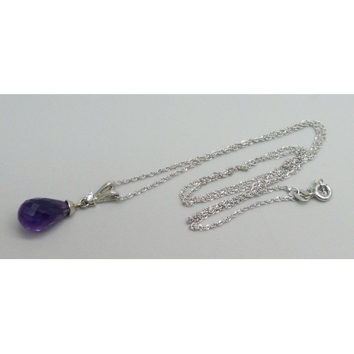 1165 - A 9ct white gold amethyst and diamond pendant on chain, 2.8g