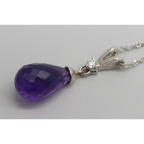 1165 - A 9ct white gold amethyst and diamond pendant on chain, 2.8g