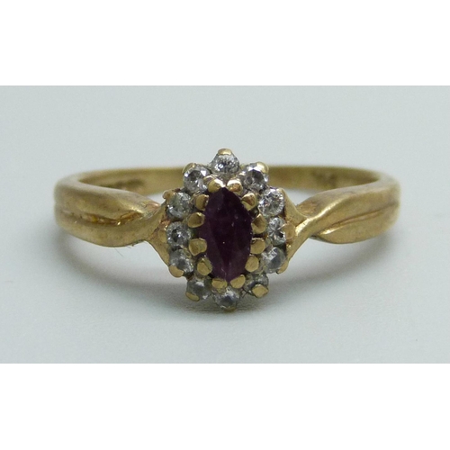 1167 - A 9ct gold ring set with a ruby and diamond cluster, 2.1g, K/L